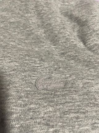 Chaqueta Lacoste Amarilla reversible. Impermeable