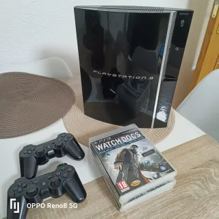 Playstation 3 con 2 mandos y 4 juegos