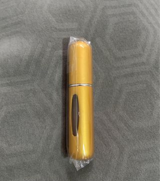 Spray de colonia para bolso dorado