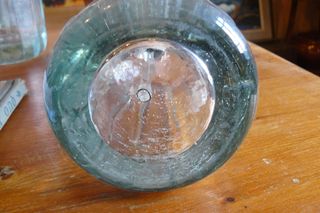 Sifón antiguo con cabeza de plomo