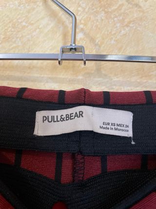 Pantalón largo campana rojo con rayas negras