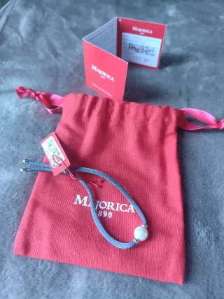 Pulsera Majorica perla ,con detalles plata.