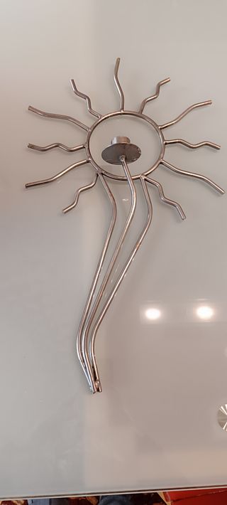 2 Portacandele a forma di sole in metallo argentato