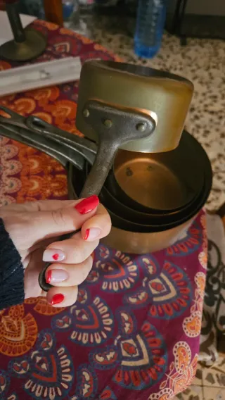 Antiguos cazos de cobre