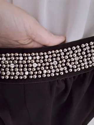 Pantaloni neri con cintura gioiello