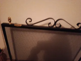 Protector de chimenea metal negro y dorado