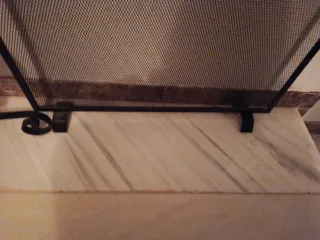 Protector de chimenea metal negro y dorado