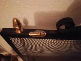 Protector de chimenea metal negro y dorado