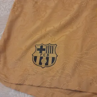 Pantalón corto dorado Nike FCB