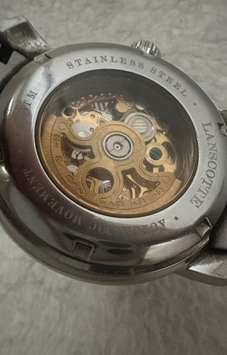 Reloj Lanscotte Esqueleto Oro y Plata