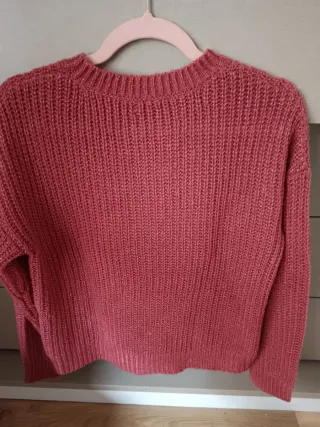 Jersey rosa con trenzas