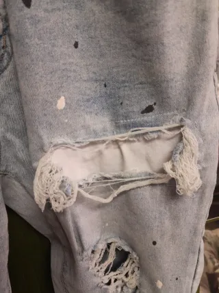 Jeans uomo strappati con stoffa interna