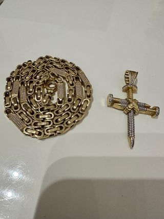 Cadena de oro 14k con colgante cruz.60gramos