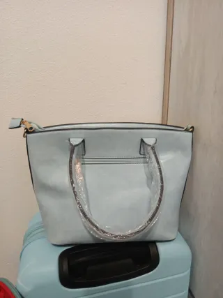 Bolso floral con lazo azul