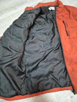 Plumífero niño naranja