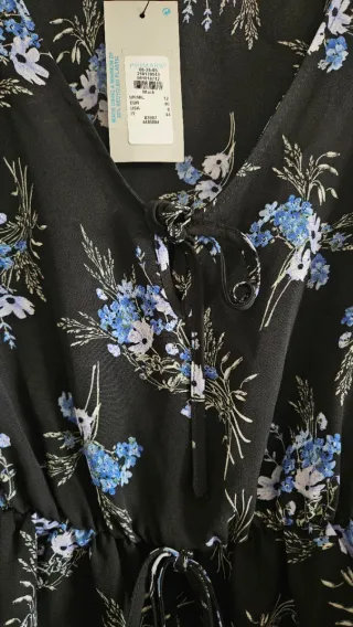 Blusa negra floral manga larga