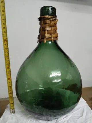 Garrafa de vidrio antigua verde