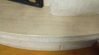 Chimenea de piedra natural con estufa de fundición