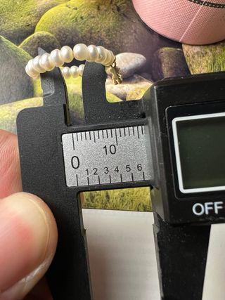 Anillo Tous de perlas con emblema oro macizo 18 k.