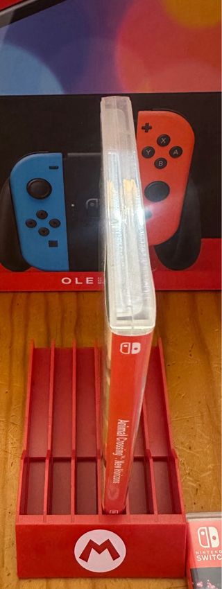 Nintendo Switch OLED neon + 6 Giochi + Accessori