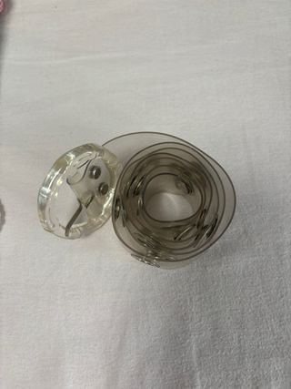 Cinturón transparente anillas plateadas