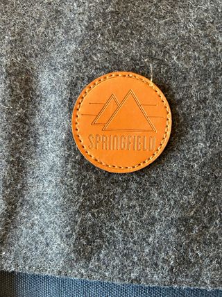 Mochila Lona Azul y gris, correas marrones.