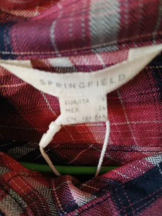 Jersey azul con camisa de cuadros