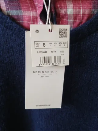 Jersey azul con camisa de cuadros