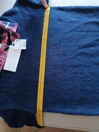 Jersey azul con camisa de cuadros