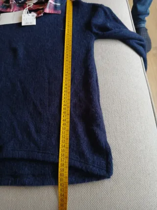 Jersey azul con camisa de cuadros