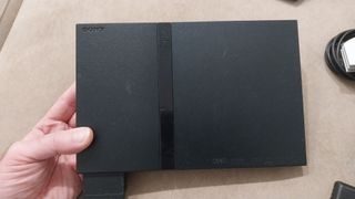 PS2 Slim Nera + 2 Controller + Gioco