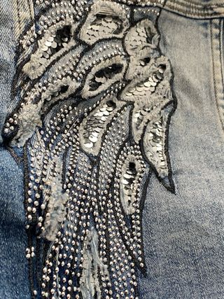 Cazadora tejana con alas plateadas