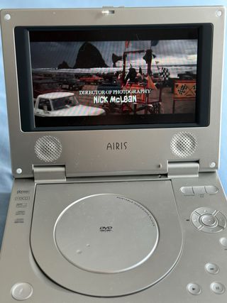 Reproductor DVD Portátil Airis y 6 películas Dvds