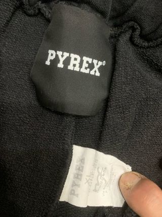 Tuta Pyrex nera con banda laterale