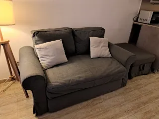 Conjunto sofá cama con reposapies con almacenaje