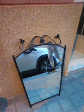 Espejo de hierro forjado curvo