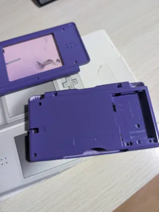 Caja Nintendo DS Lite con manuales y carcasa lila