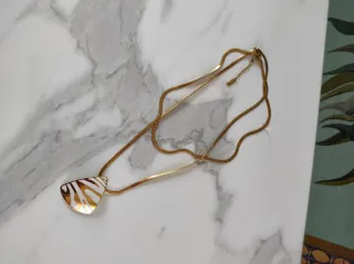 Doppia collana con pendente geometrico oro panna