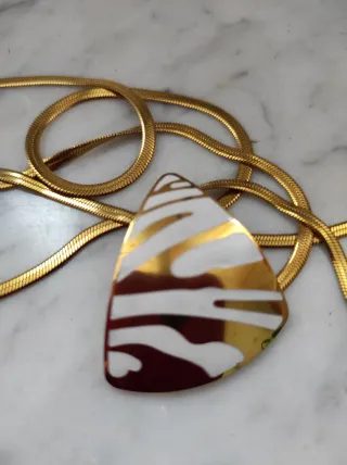 Doppia collana con pendente geometrico oro panna