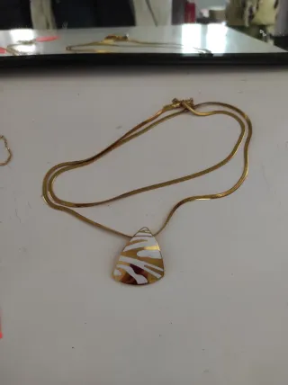 Doppia collana con pendente geometrico oro panna
