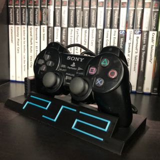 Soporte con mando PS2 de exposición