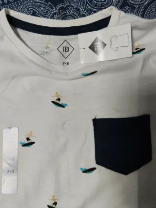 Camiseta blanca estampada surf T7-8 si estrenar.