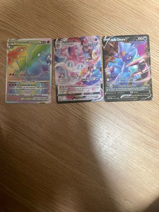 Cartas Pokémon Charizard VMAX, Sylveon VMAX, Onura