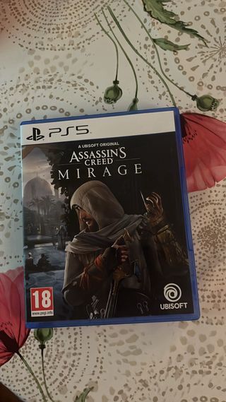 PS5 con Mando Rojo y Assassin's Creed Mirage