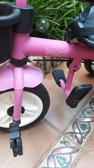 Triciclo rosa evolutivo con asa