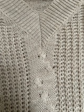 Jersey beige con flecos