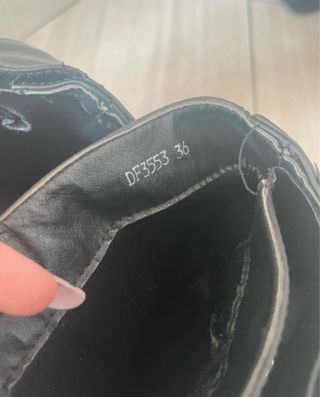 Stivali neri in simil pelle con fibbia argento