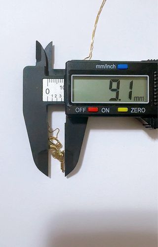 Collana con pendente pistola in oro 18kt 750