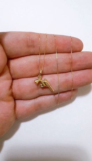 Collana con pendente pistola in oro 18kt 750