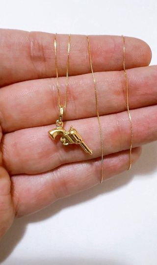 Collana con pendente pistola in oro 18kt 750